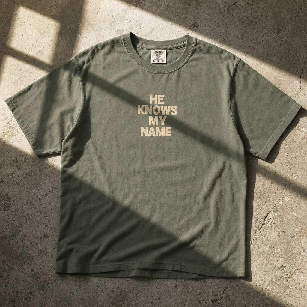 HE KNOWS MY NAME TEE