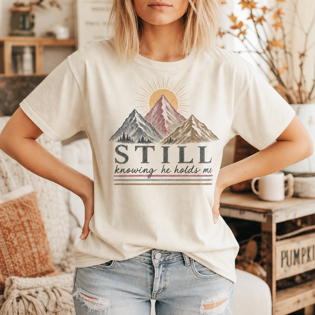 STILL KNOWING HE HOLDS ME TEE